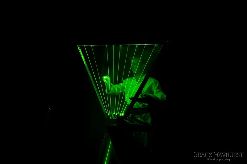 Moray playing the Laser Harp on stage at the Rondo Theatre in 2025
